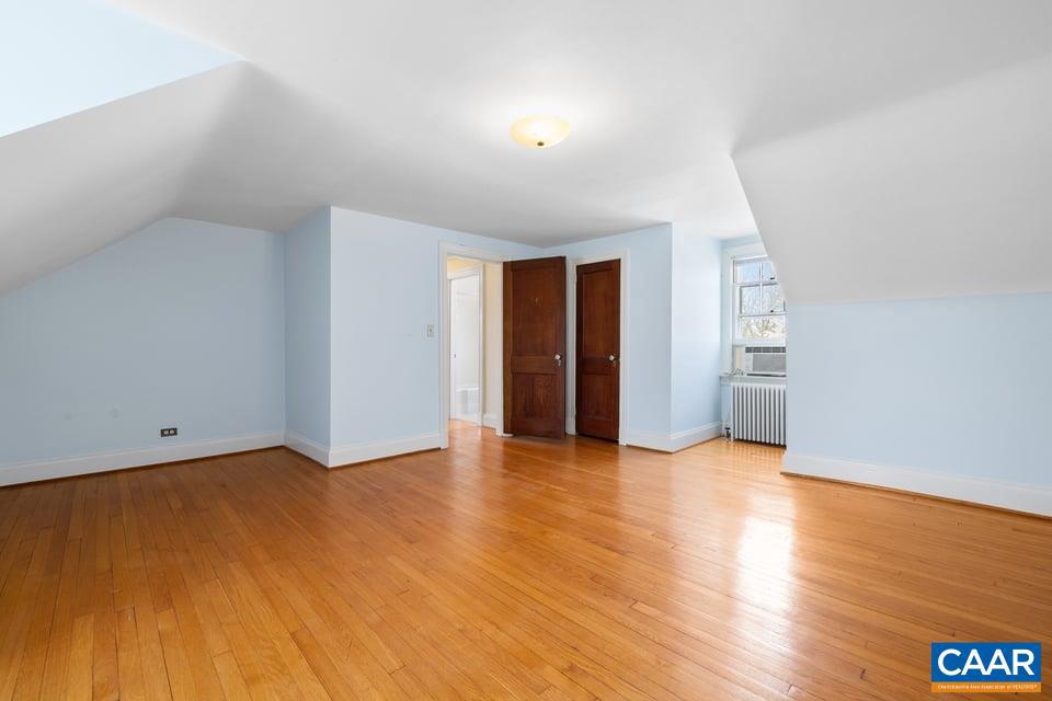 1201 Avon Street Charlottesville, VA 22902 - Photo 49 of 71 an empty room with wooden floor and closet