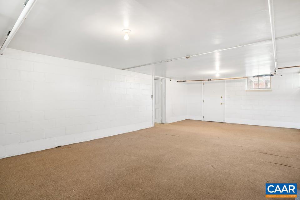 1201 Avon Street Charlottesville, VA 22902 - Photo 56 of 71 an empty room with an entryway and fan