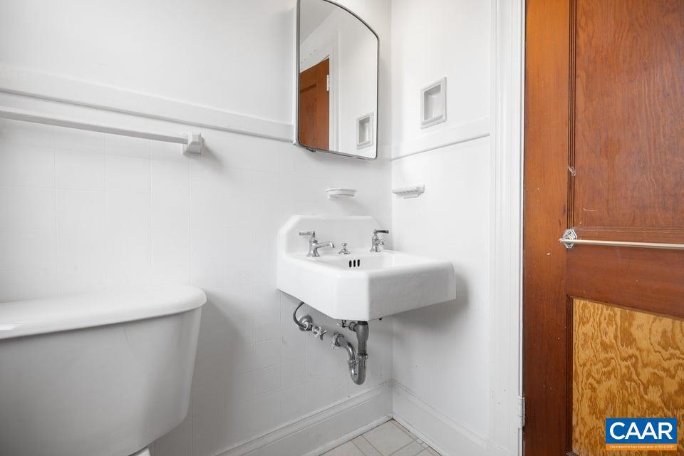 1201 Avon Street Charlottesville, VA 22902 - Photo 60 of 71 a bathroom with a sink and mirror