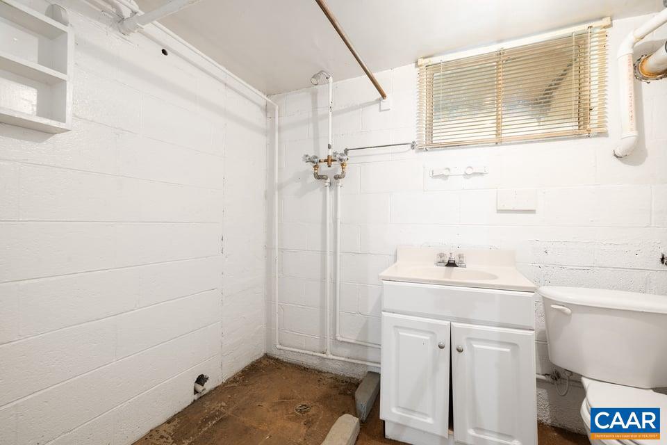 1201 Avon Street Charlottesville, VA 22902 - Photo 62 of 71 a bathroom with a sink a toilet and vanity