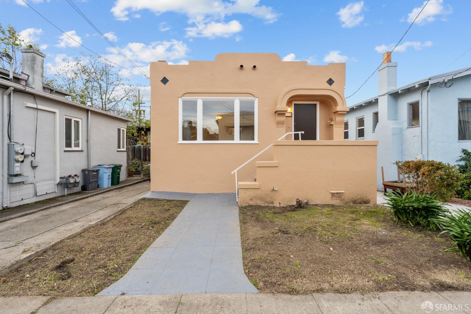1644 Kains Avenue Berkeley, CA 94702 - Photo 1 of 1 a front view of a house with a yard