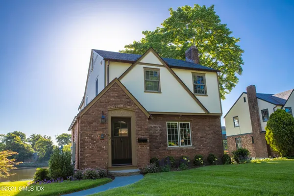 front view of a house with a yard