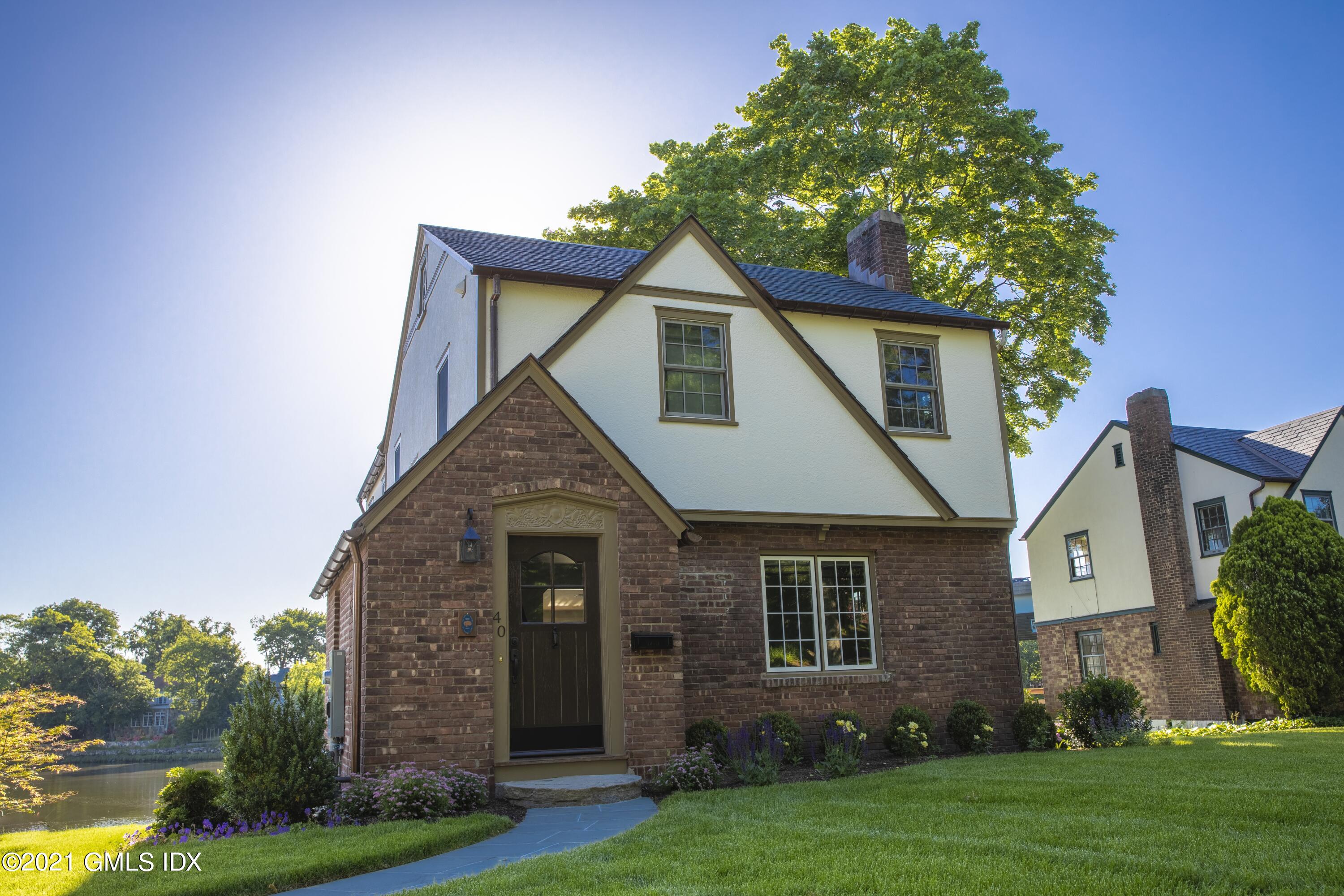front view of a house with a yard