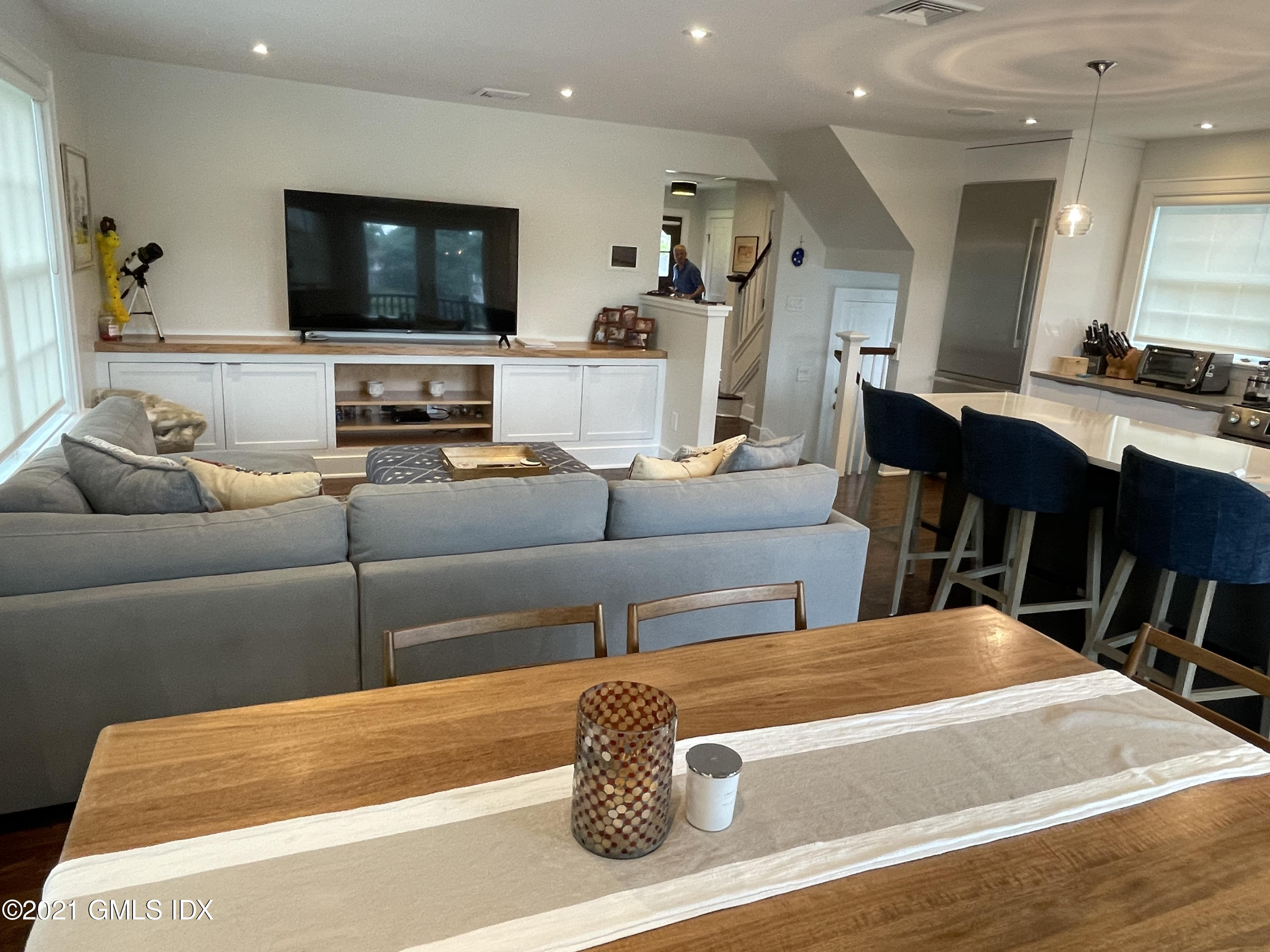 40 Strickland Road Cos Cob, CT 06807 - Photo 2 of 22 a living room with furniture and a flat screen tv