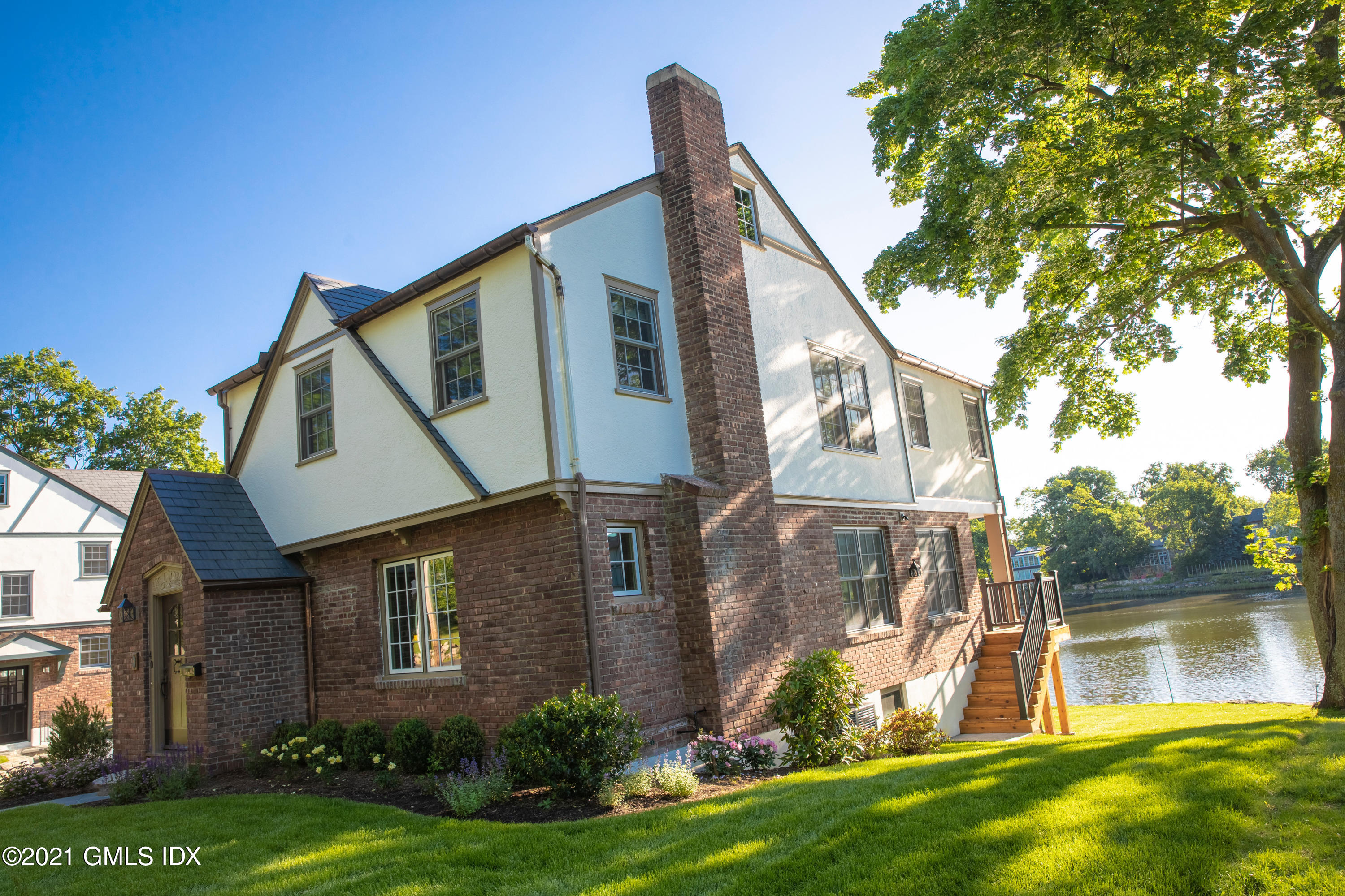 40 Strickland Road Cos Cob, CT 06807 - Photo 22 of 22 a view of a house with a yard