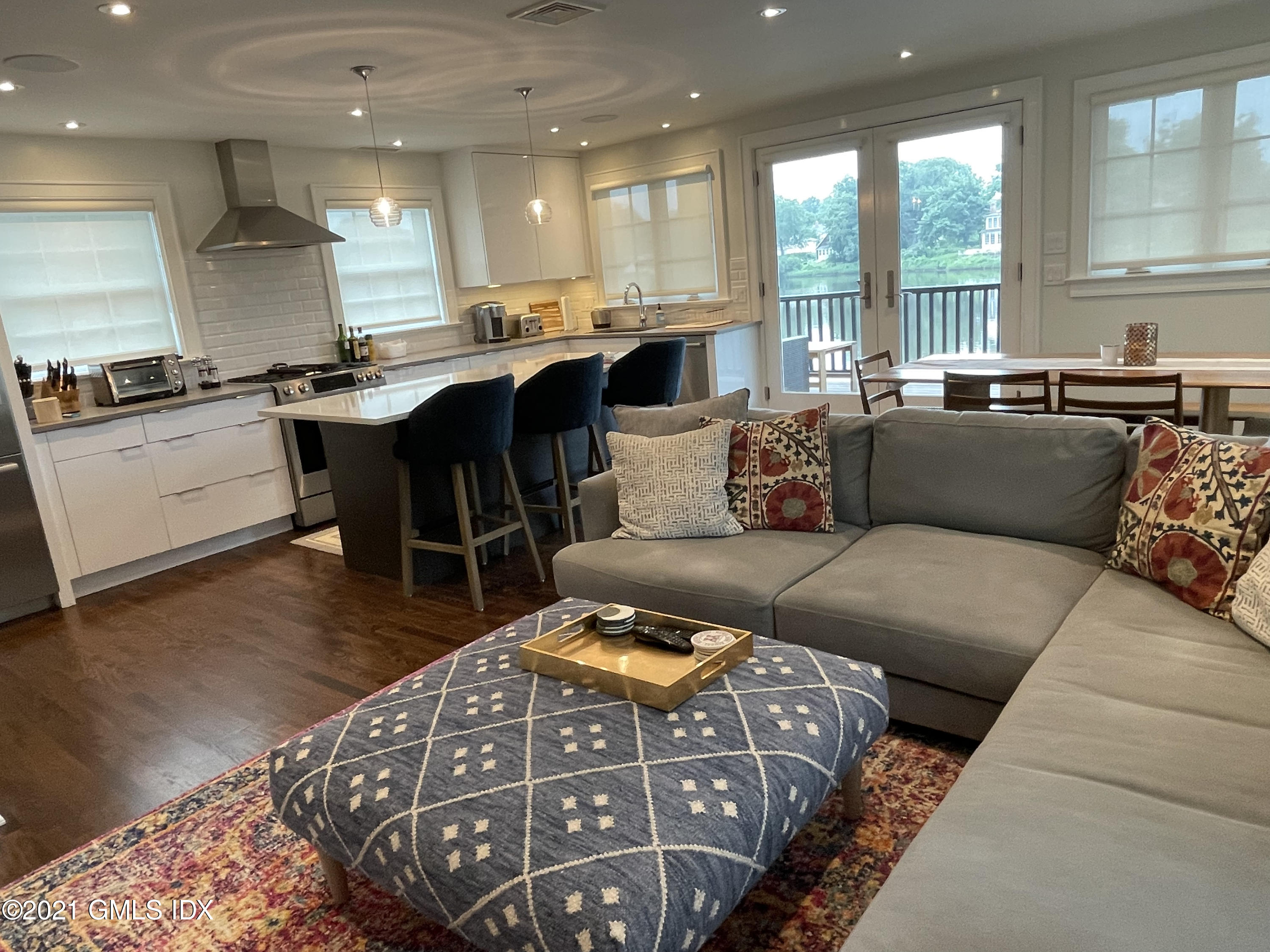 40 Strickland Road Cos Cob, CT 06807 - Photo 6 of 22 a living room with furniture and a large window