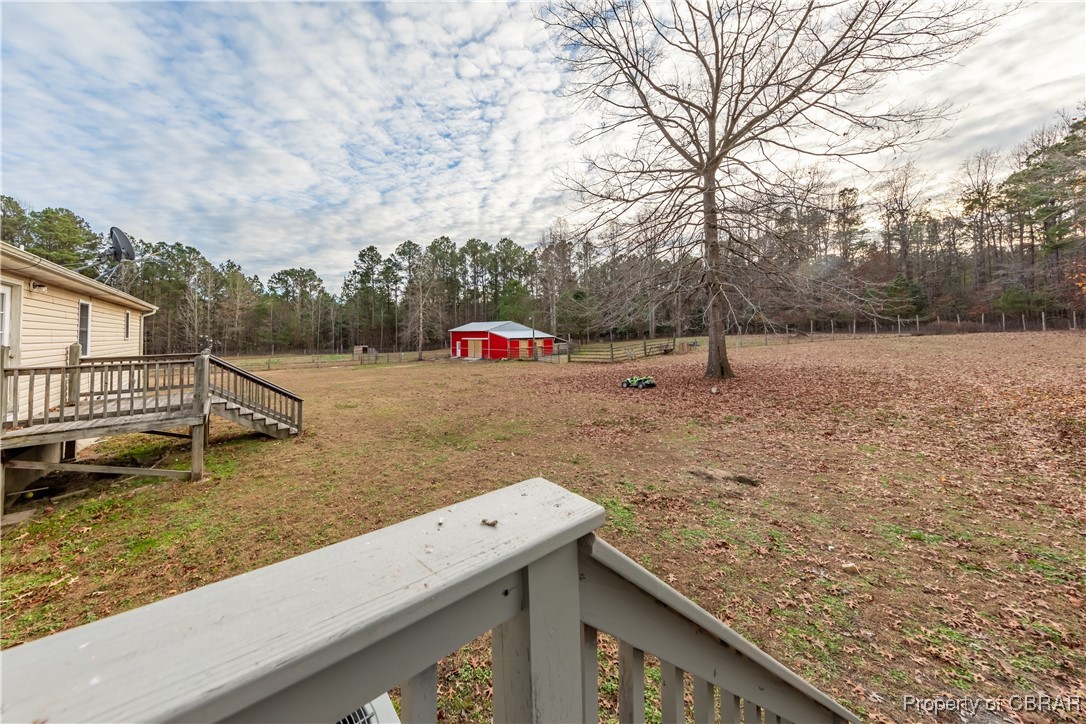 9534 Gee Farm Road Gloucester, VA 23061 - Photo 35 of 48 View of yard featuring a wooden deck and an outbuilding
