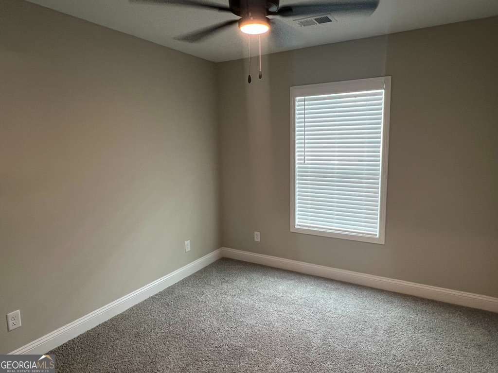 403 Madison Avenue St. Marys, GA 31558 - Photo 5 of 21 an empty room with a window
