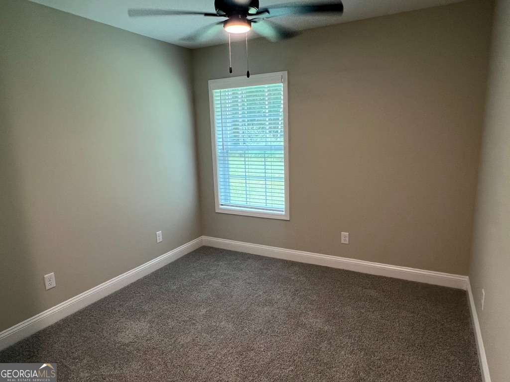 403 Madison Avenue St. Marys, GA 31558 - Photo 9 of 21 an empty room with a window