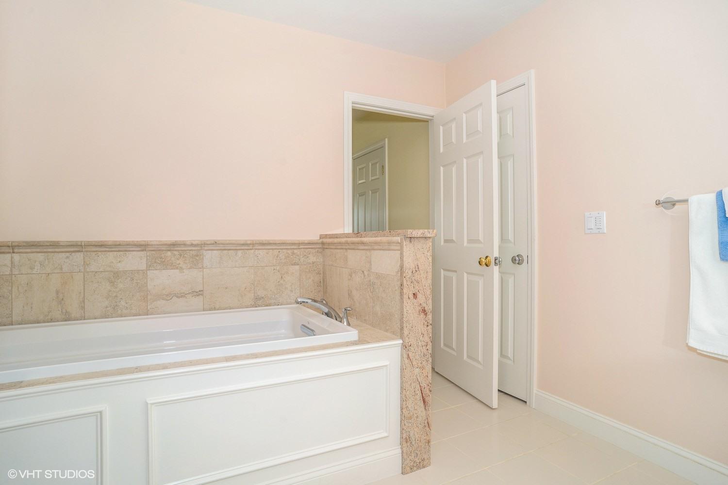68 Brookside Road Bourne, MA 02532 - Photo 11 of 15 a bathroom with a bathtub and shower