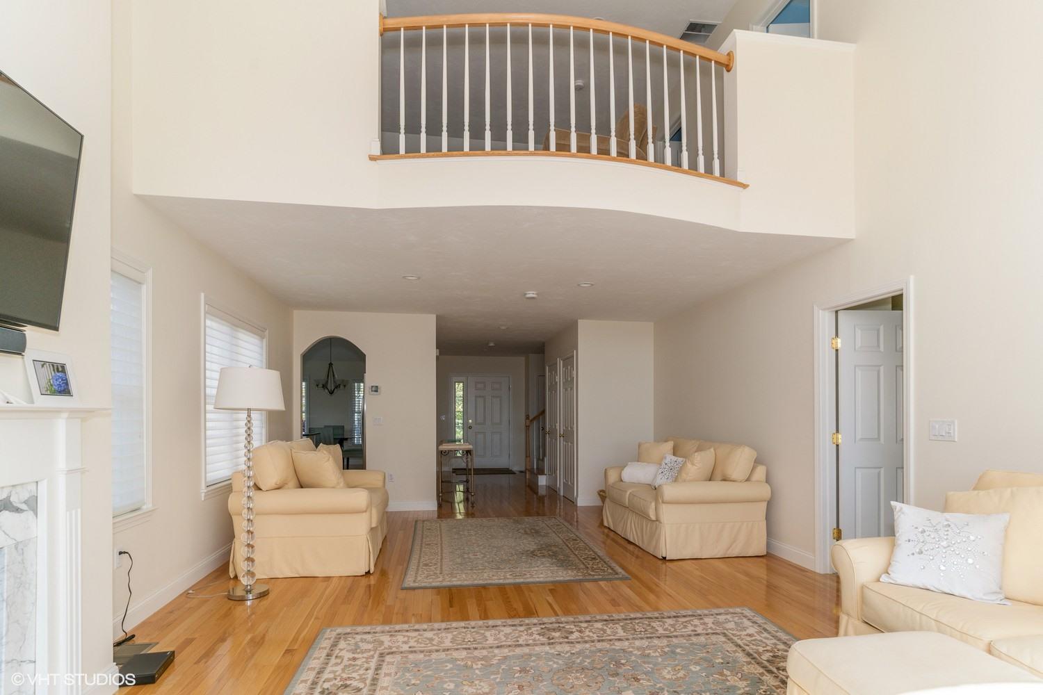 68 Brookside Road Bourne, MA 02532 - Photo 4 of 15 a living room with furniture and a mirror