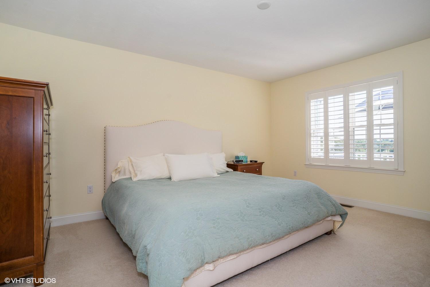 68 Brookside Road Bourne, MA 02532 - Photo 9 of 15 a bedroom with a bed and next to a window