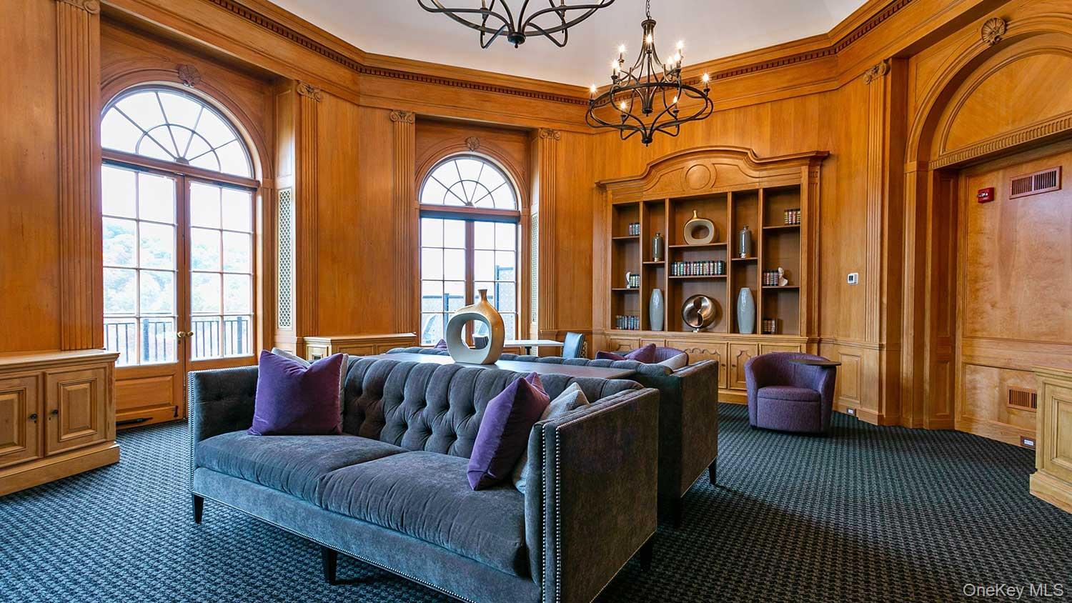 480 Bedford Road, Unit 210 Chappaqua, NY 10514 - Photo 2 of 11 a living room with furniture a chandelier and a window