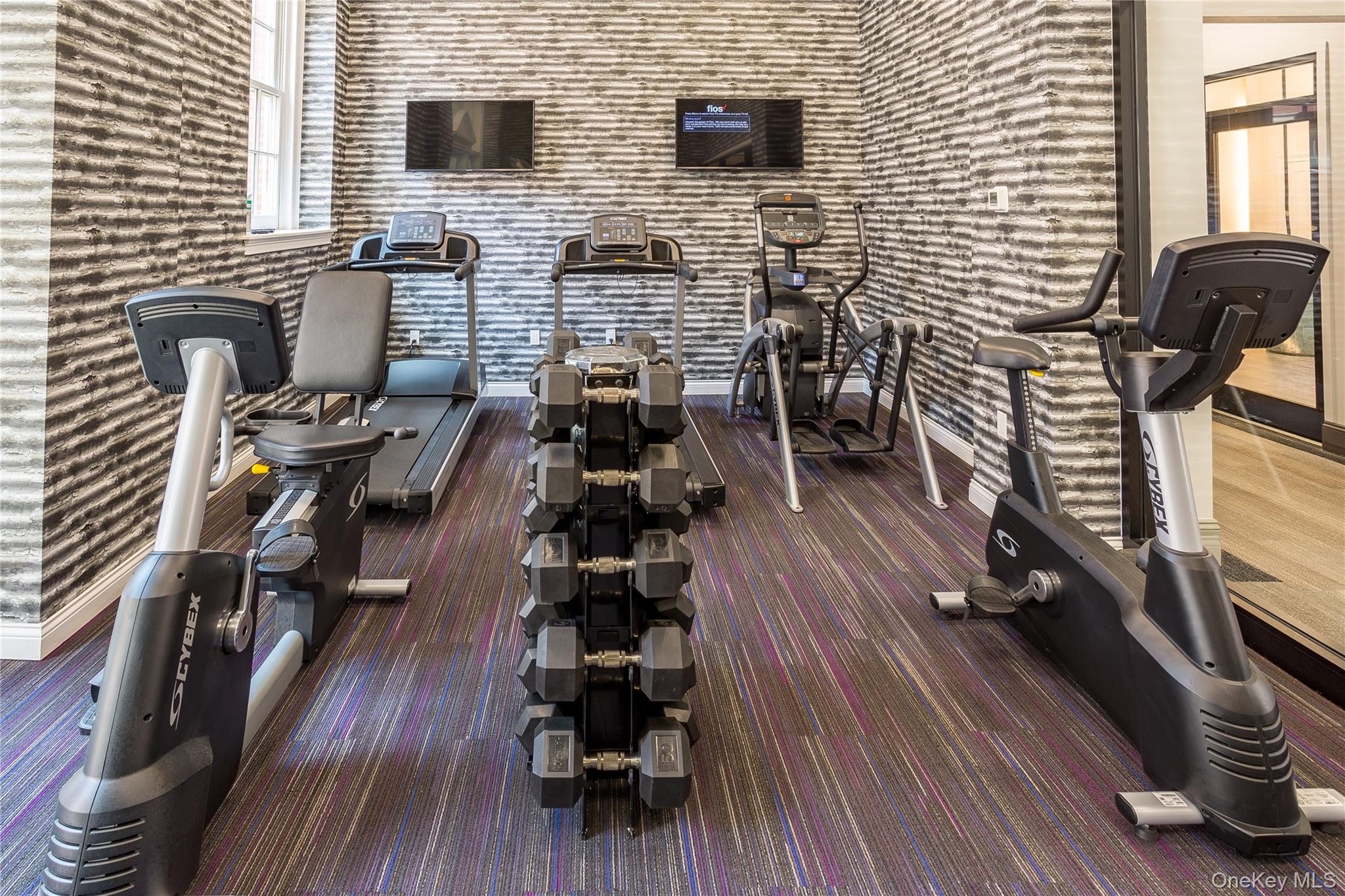 480 Bedford Road, Unit 210 Chappaqua, NY 10514 - Photo 7 of 11 a view of a livingroom with furniture and wooden floor