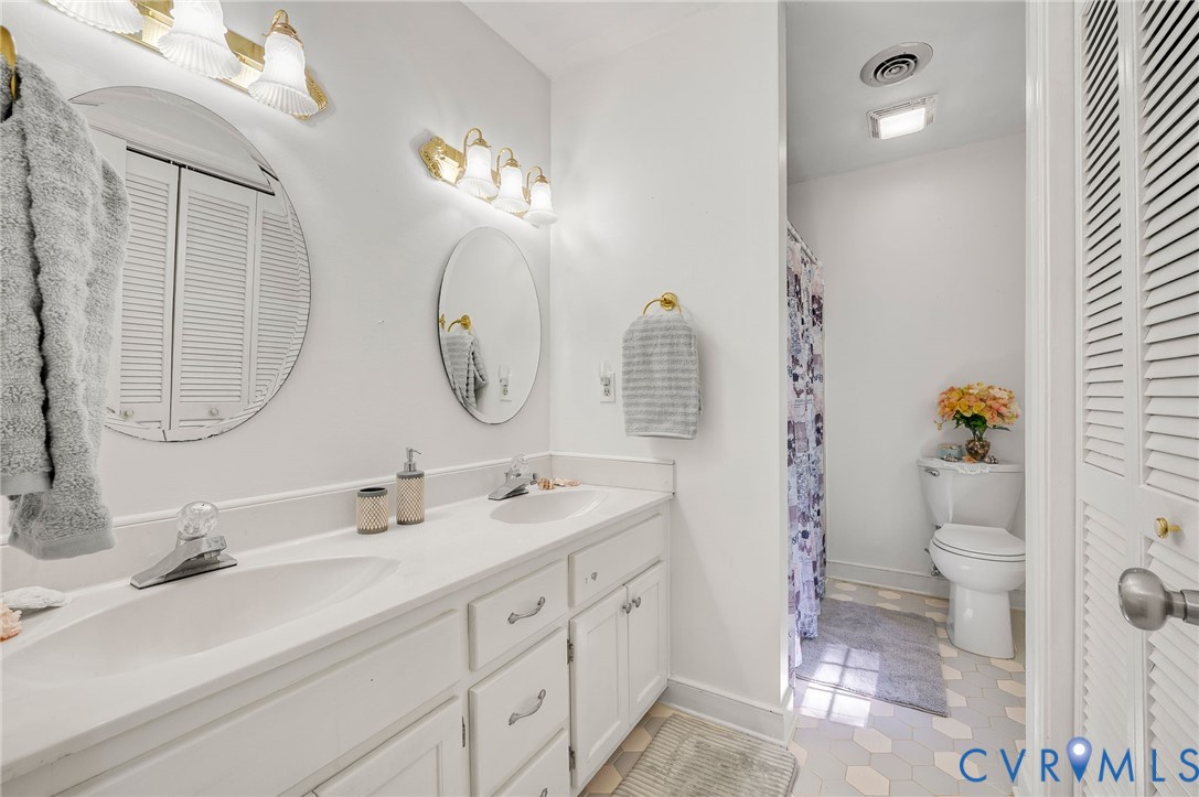 2409 Three Bridge Road Powhatan, VA 23139 - Photo 31 of 39 Dual vanity with integrated sinks, white cabinetry