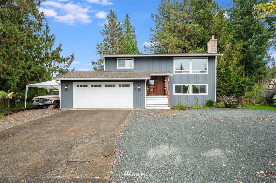 5942 Longdin Road Ferndale, WA 98248 - Photo 1 of 30 a view of a house with a yard and garage