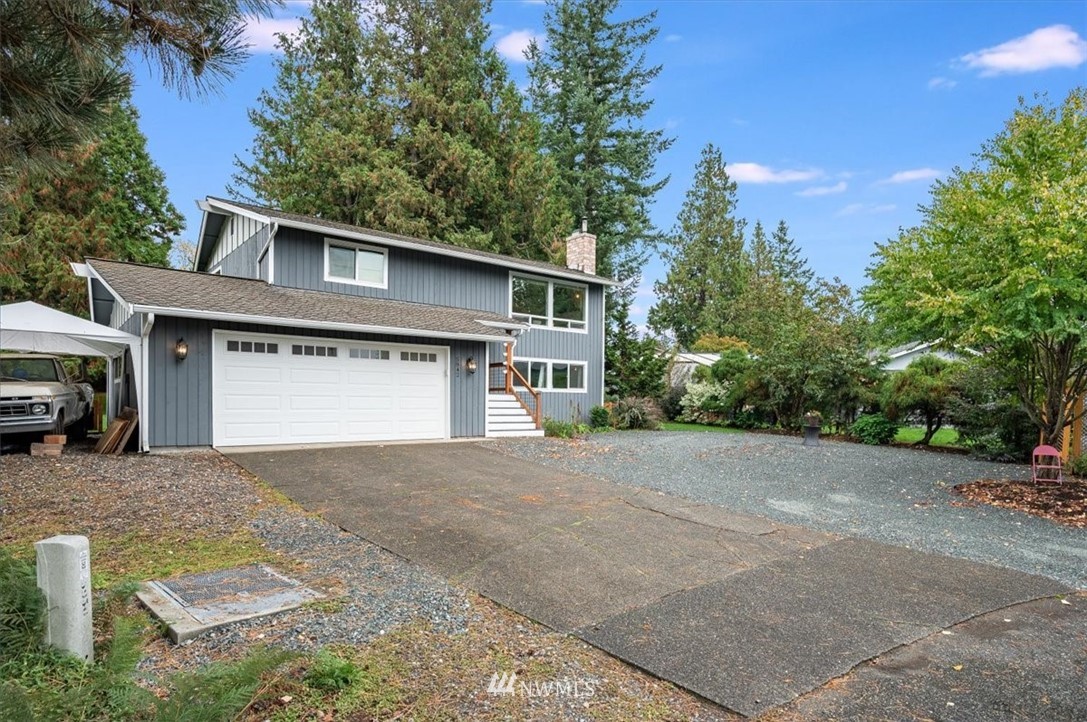 5942 Longdin Road Ferndale, WA 98248 - Photo 20 of 30 a front view of a house with a yard and garage