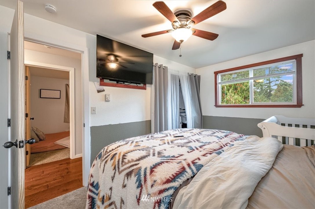 5942 Longdin Road Ferndale, WA 98248 - Photo 3 of 30 a bedroom with a bed and a flat screen tv