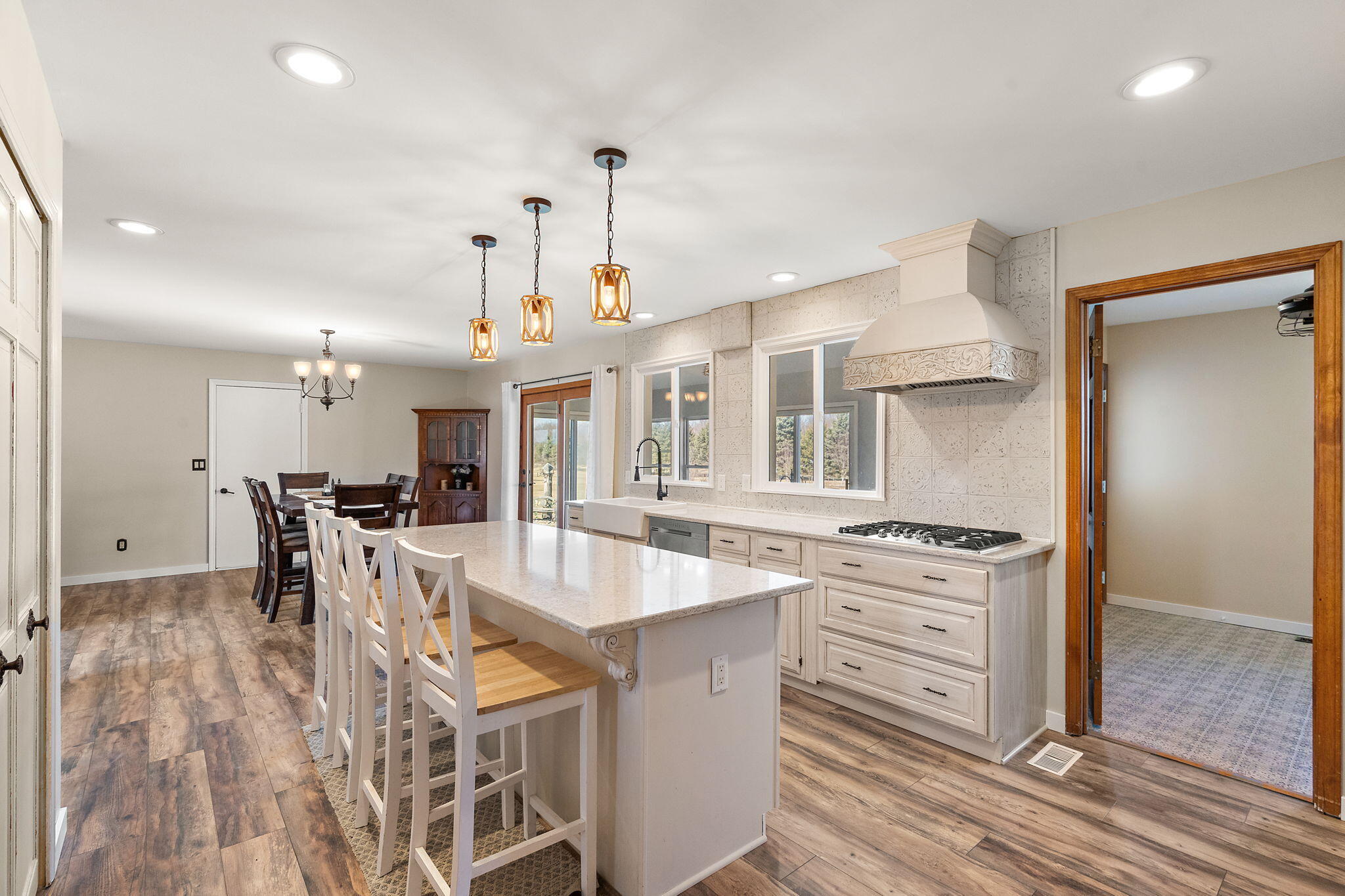 1790 West 134th Court Crown Point, IN 46307 - Photo 16 of 53 an open kitchen with a table and chairs