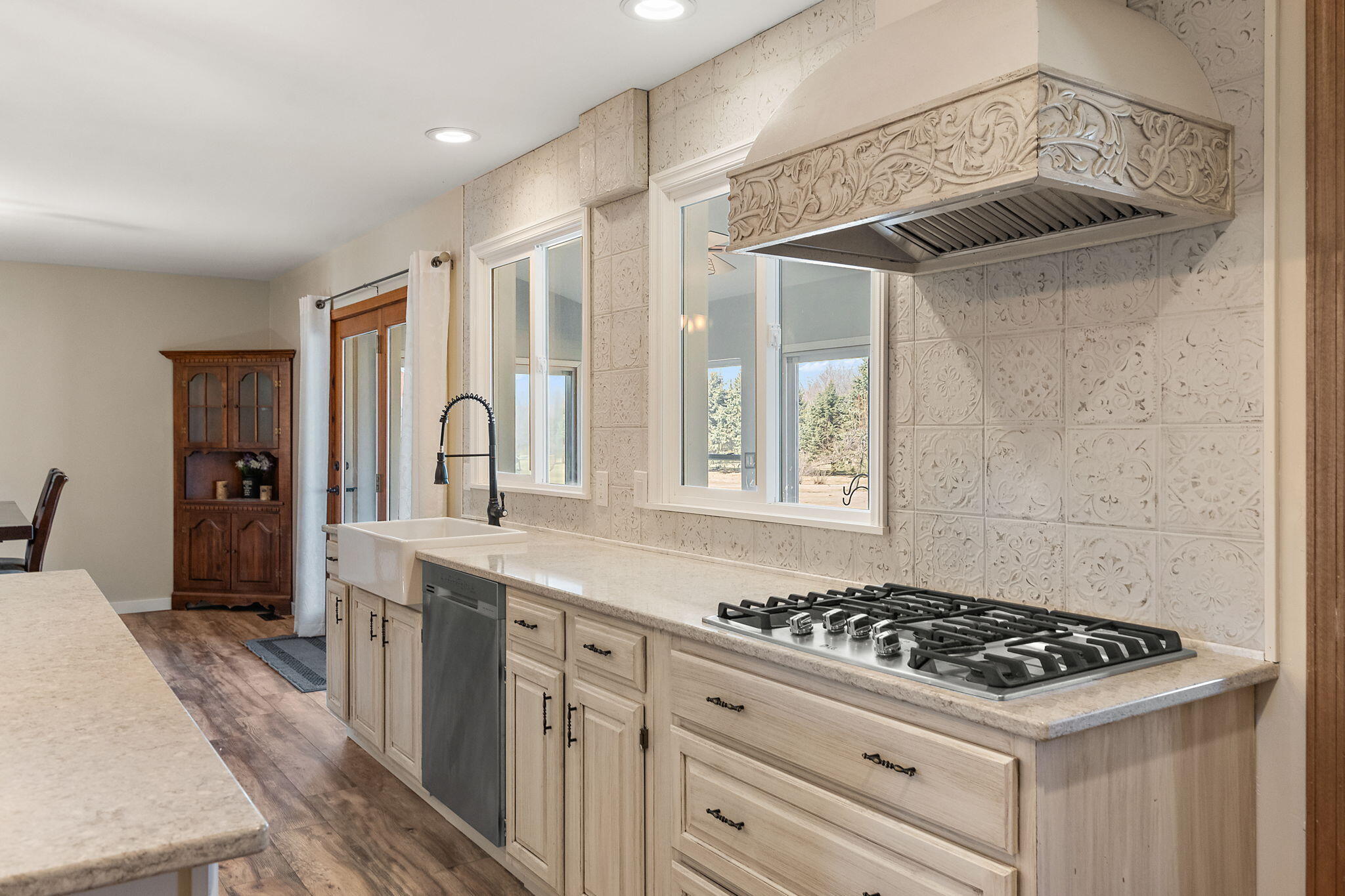 1790 West 134th Court Crown Point, IN 46307 - Photo 18 of 53 a kitchen with stainless steel appliances a stove a sink and a refrigerator