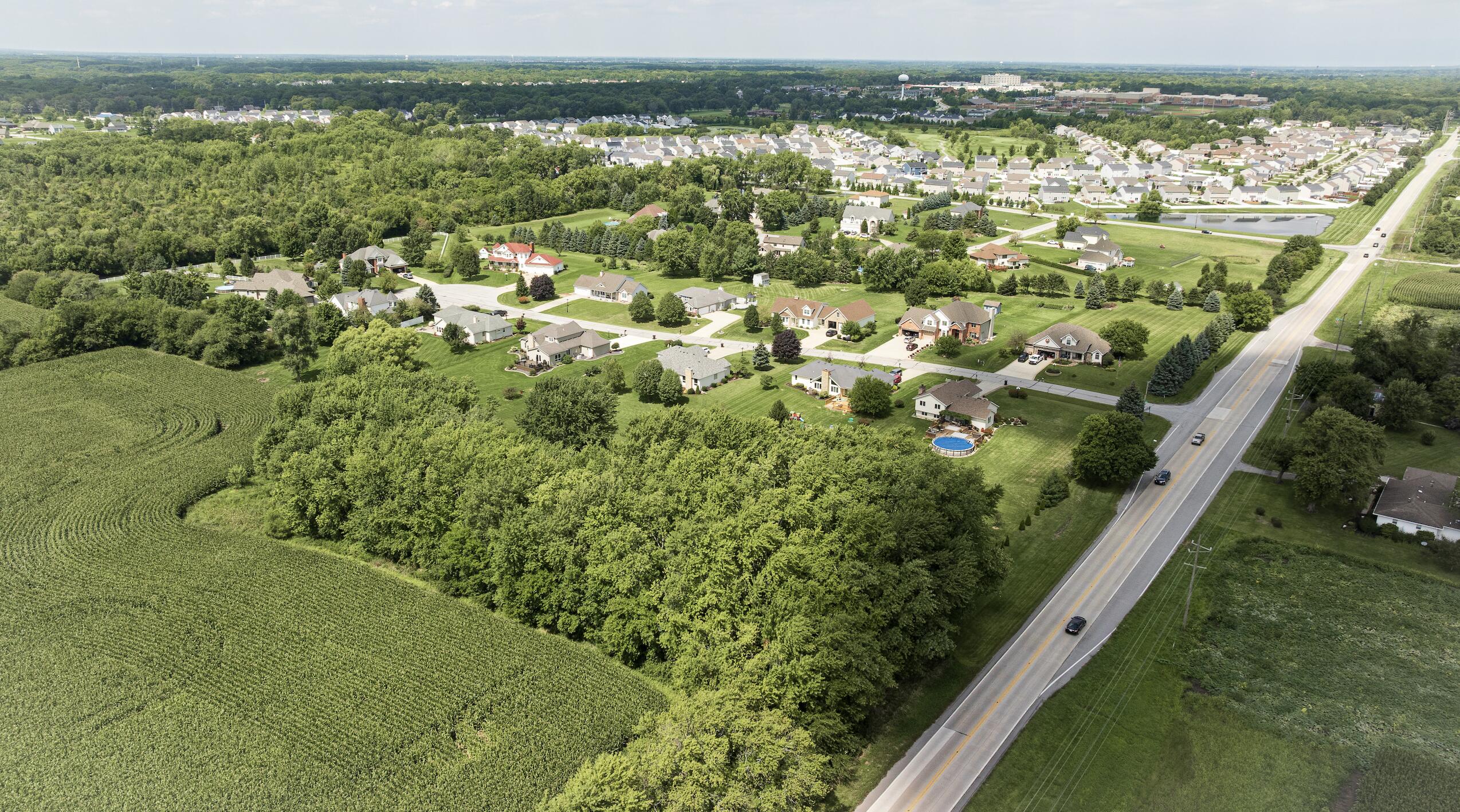 1790 West 134th Court Crown Point, IN 46307 - Photo 52 of 53 an aerial view of residential houses with outdoor space and trees