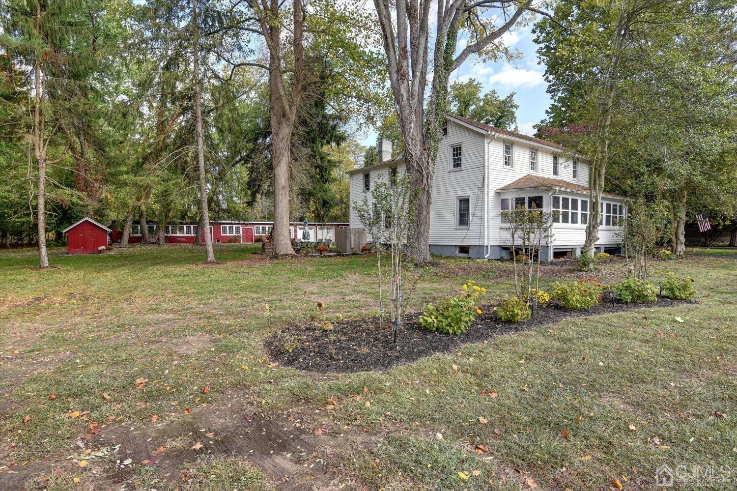 588 Adelphia Road Freehold, NJ 07728 - Photo 1 of 67 a view of a house with a yard and sitting area