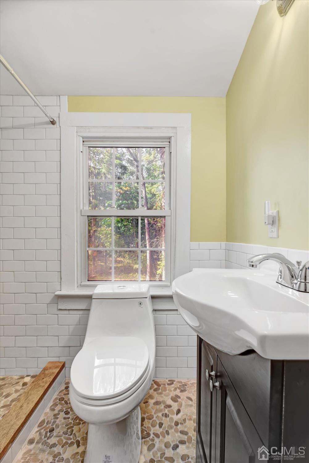 588 Adelphia Road Freehold, NJ 07728 - Photo 27 of 67 a bathroom with a sink and a toilet