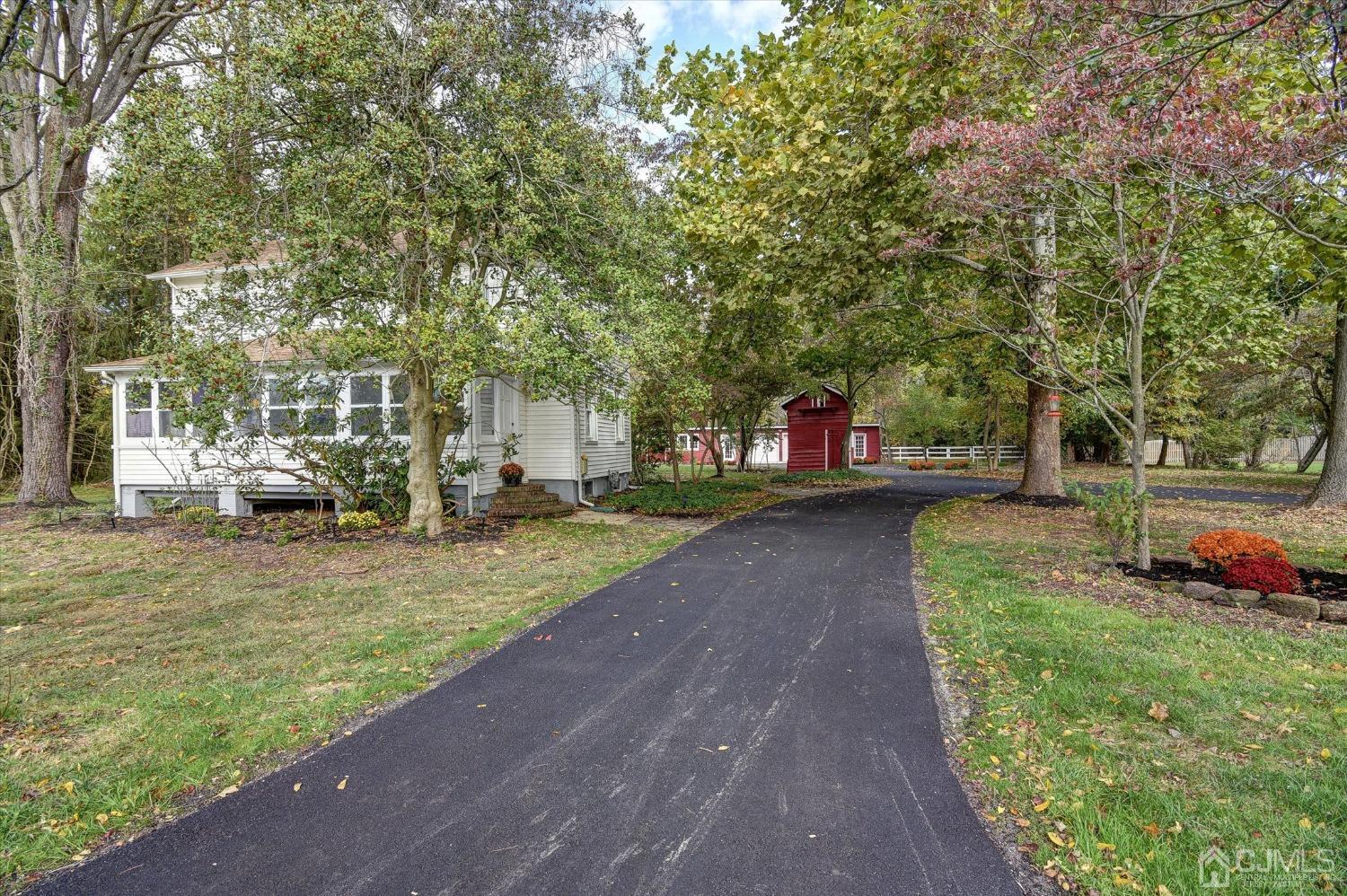588 Adelphia Road Freehold, NJ 07728 - Photo 29 of 67 a view of a park with large trees