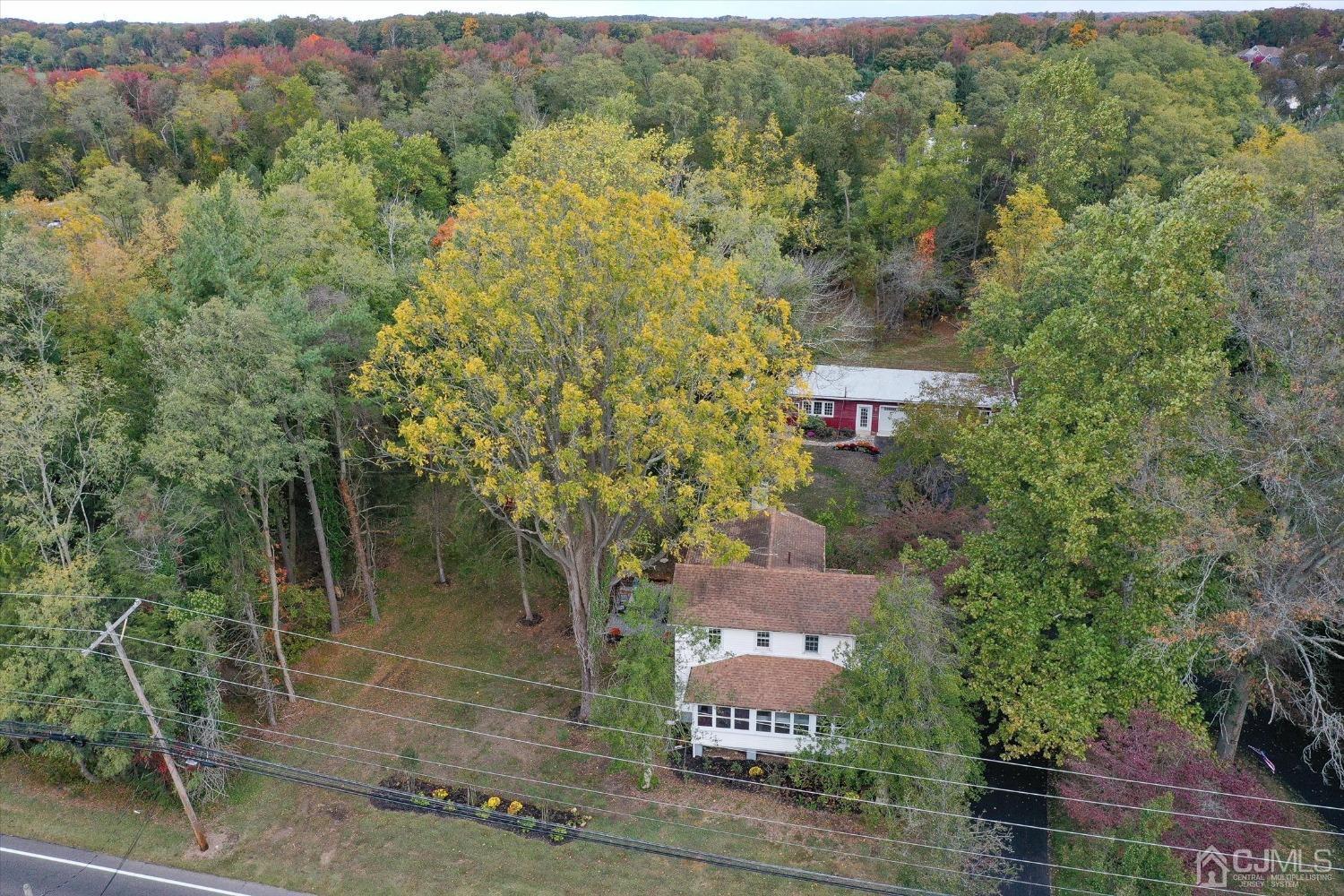 588 Adelphia Road Freehold, NJ 07728 - Photo 45 of 67 an aerial view of residential house with outdoor space and trees all around