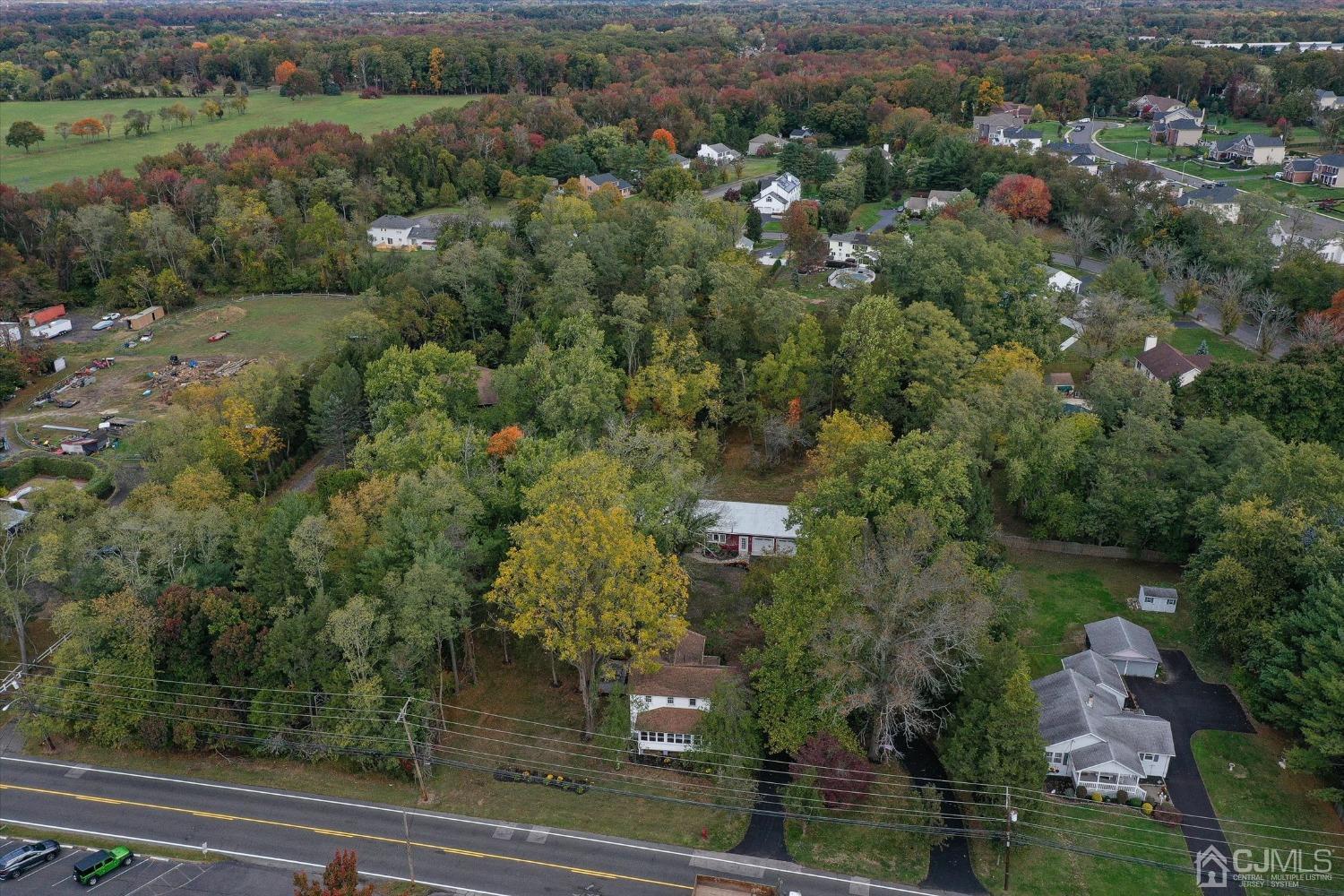 588 Adelphia Road Freehold, NJ 07728 - Photo 47 of 67 an aerial view of a residential houses with outdoor space and trees
