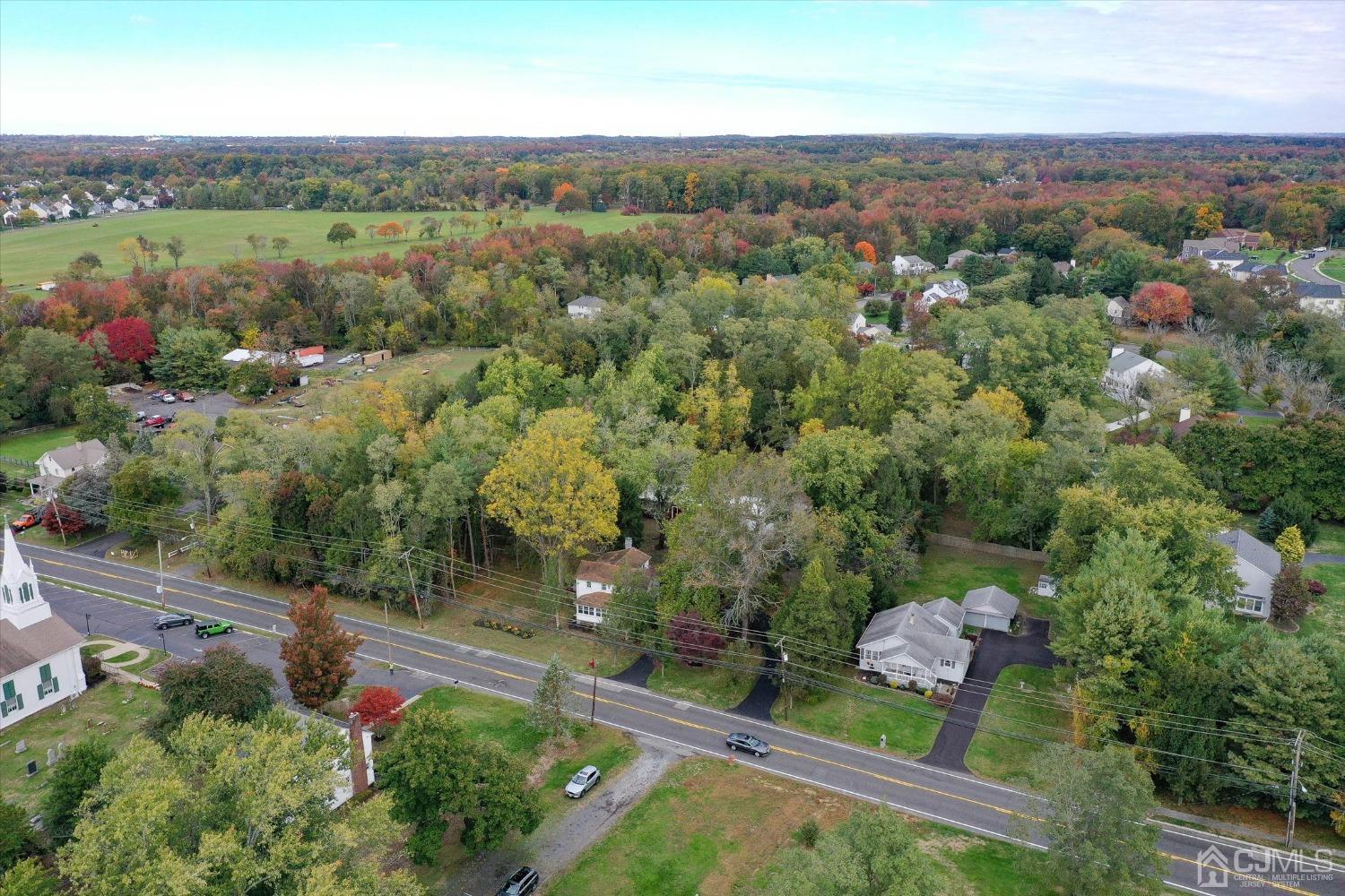 588 Adelphia Road Freehold, NJ 07728 - Photo 54 of 67 an aerial view of green landscape with trees houses and mountain view
