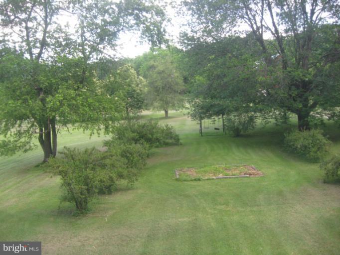 24 Houck Road Westminster, MD 21157 - Photo 7 of 14 a view of a lake with a yard