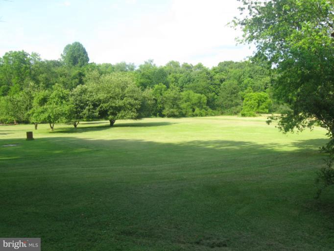 24 Houck Road Westminster, MD 21157 - Photo 8 of 14 a view of a golf course with a lake