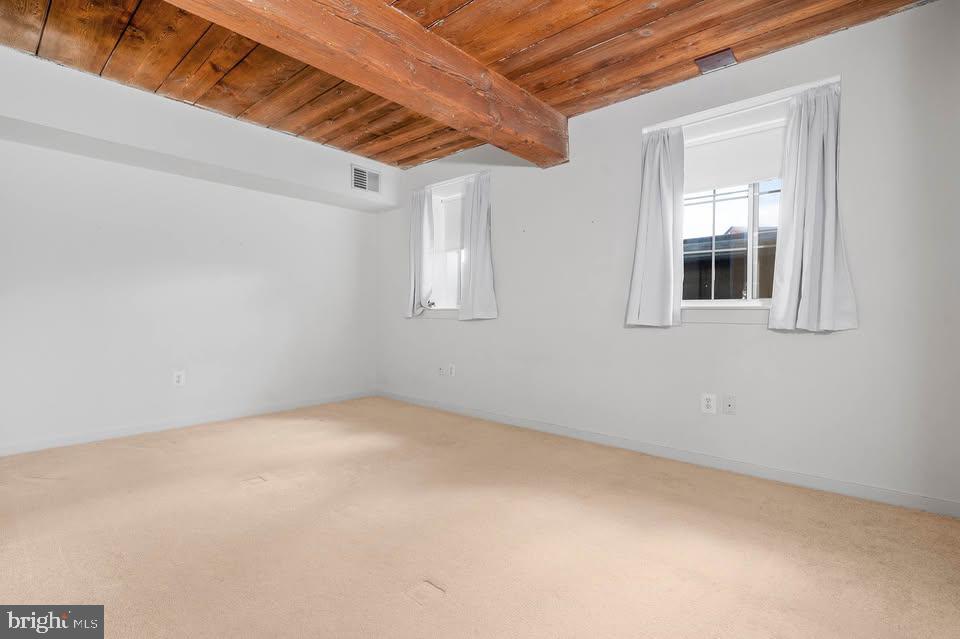 2639 Boston Street, Unit 104 Baltimore, MD 21224 - Photo 12 of 25 an empty room with windows