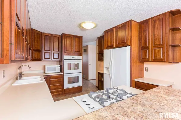 a kitchen with stainless steel appliances a refrigerator and a sink