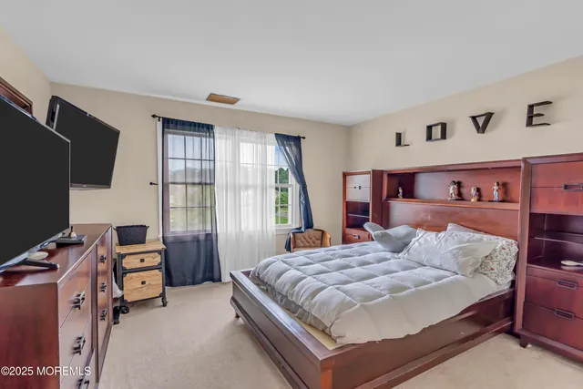 a view of a backyard with sitting area and garden