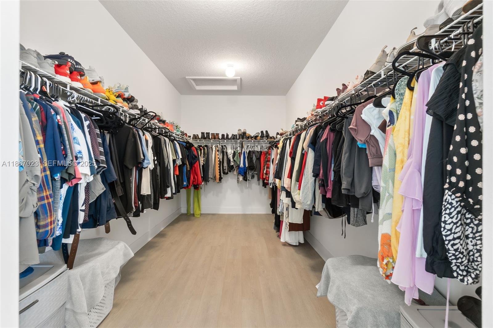 4948 Gambero Way Ave Maria, FL 34142 - Photo 17 of 28 a view of walk in closet with clothes and shoes