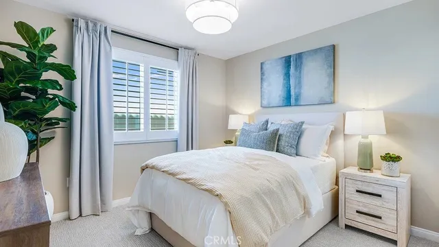 a bedroom with bed and a window