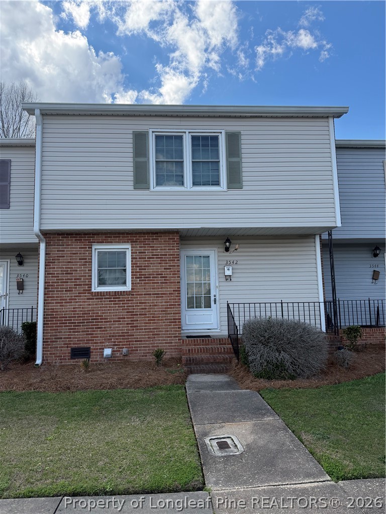 3542 Fayetteville Road Lumberton, NC 28358 - Photo 1 of 5 a front view of a house with a garden