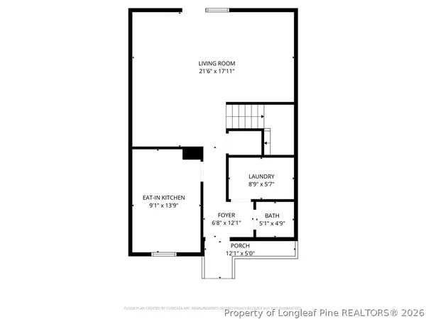 a view of a backyard with wooden fence