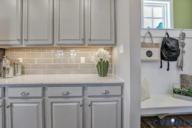 a room with a workspace and a couch