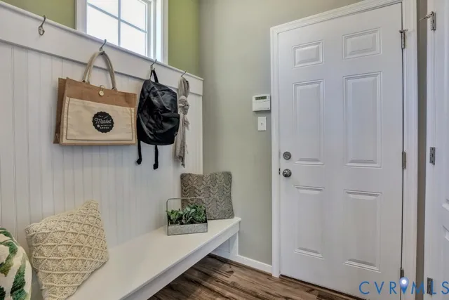 a spacious bedroom with a bed and glass door