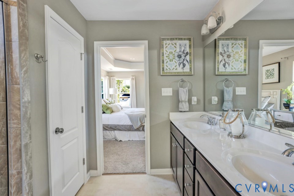 985 Charlemagne Road Midlothian, VA 23114 - Photo 25 of 42 a en suite bathroom with a granite countertop sink and a mirror