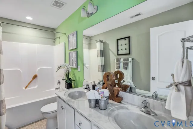 a bedroom with a large bed and a large window