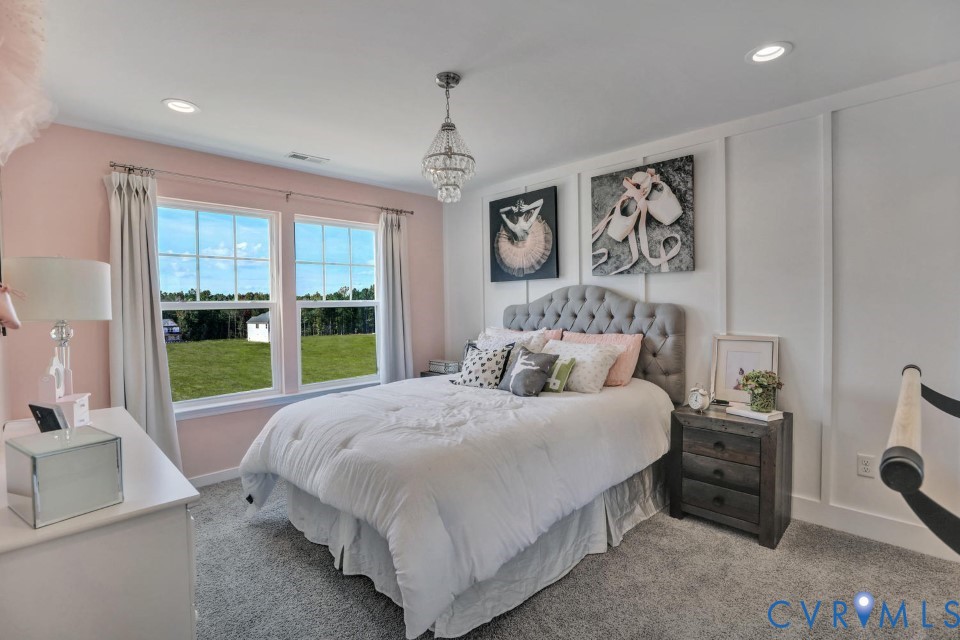 985 Charlemagne Road Midlothian, VA 23114 - Photo 29 of 42 a bedroom with a large bed and a large window