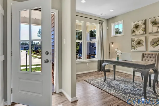 a view of a livingroom with furniture and window