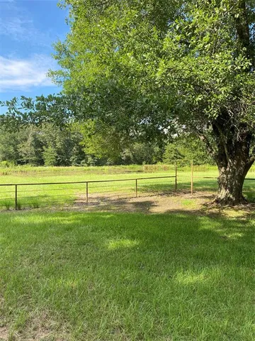 a view of a golf course with a trees