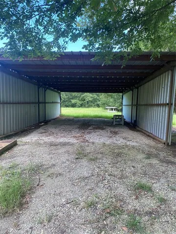 a view of a backyard with wooden fence