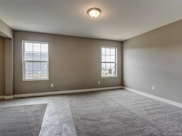 an empty room with windows