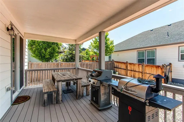 a view of a patio with wooden floor